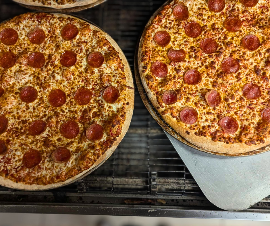 Two extra-large pepperoni pizzas fresh out of the oven for our Sunday deal