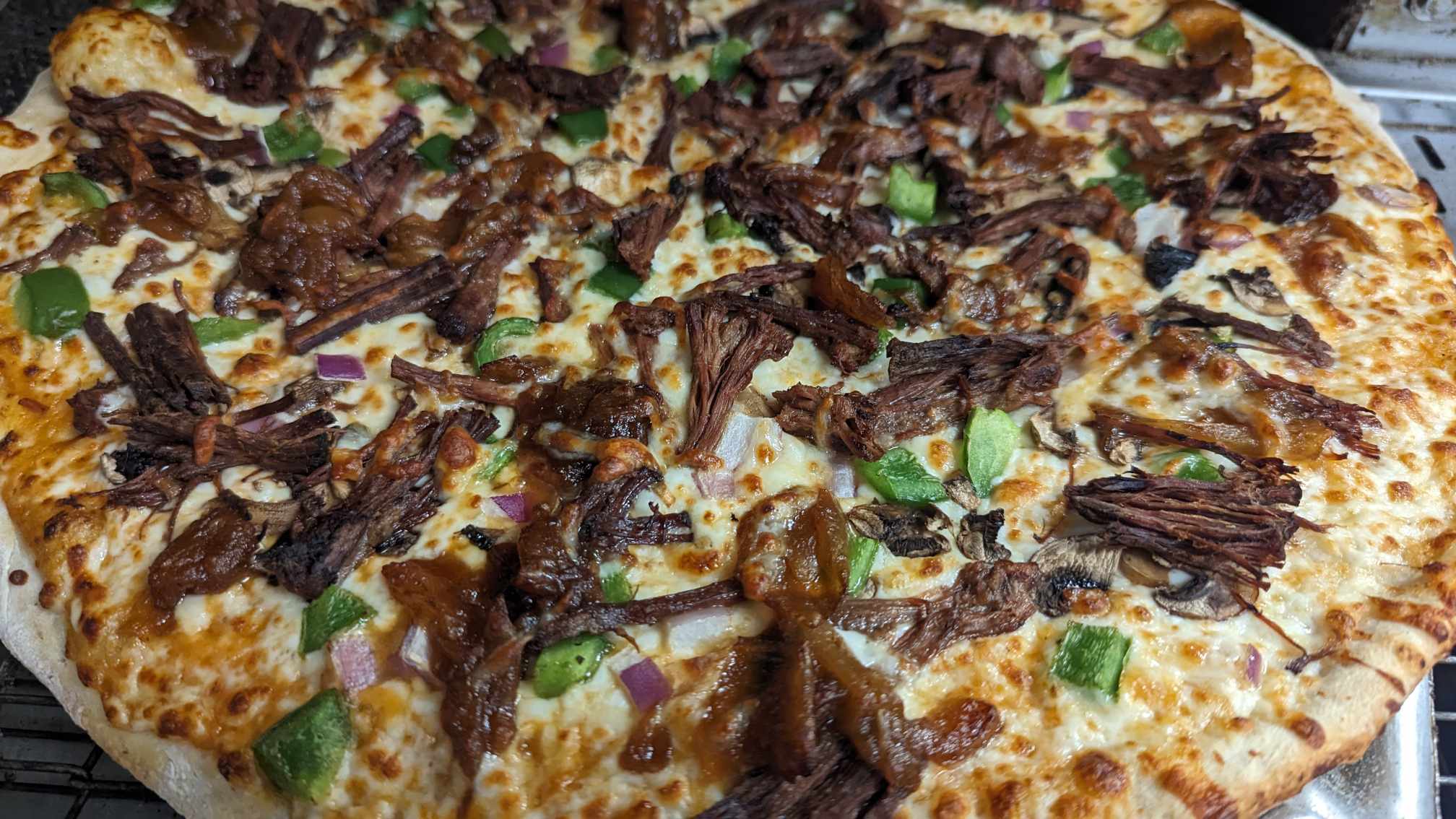 Fresh pizza being served at Eat Local Pizza in Thunder Bay