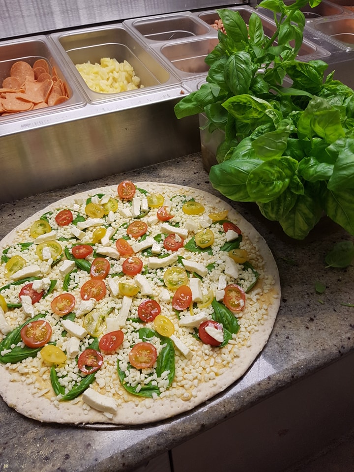 Locally sourced toppings on a handcrafted Eat Local pizza